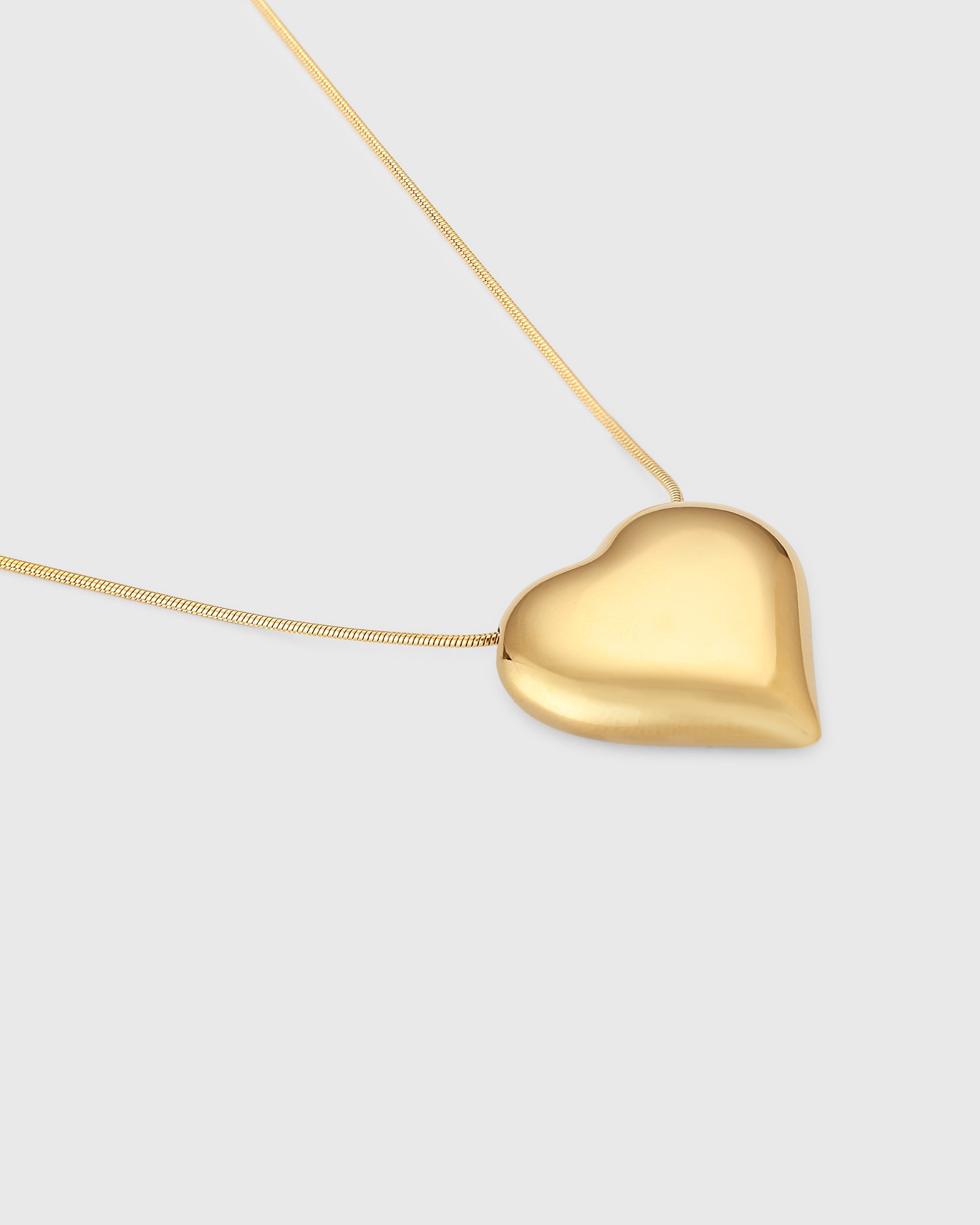 ASOS DESIGN pendant necklace with large puff heart detail in gold tone |  ASOS